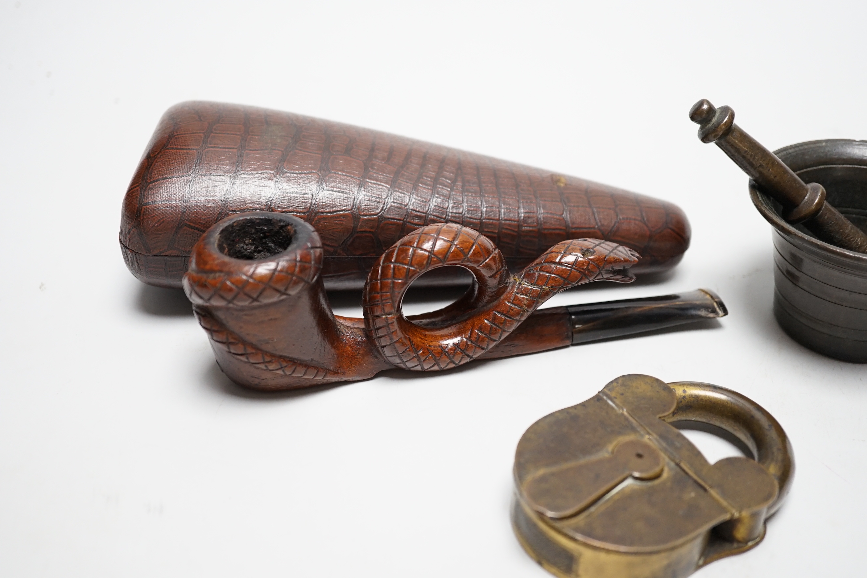 A novelty cased pipe, a miniature pestle and mortar and a novelty vesta case